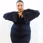 Abito con drappeggio